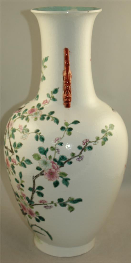 A large Chinese famille rose twin handled bottle vase, Qianlong seal mark, late 19th century, 54cm., foot ground off in manufacture